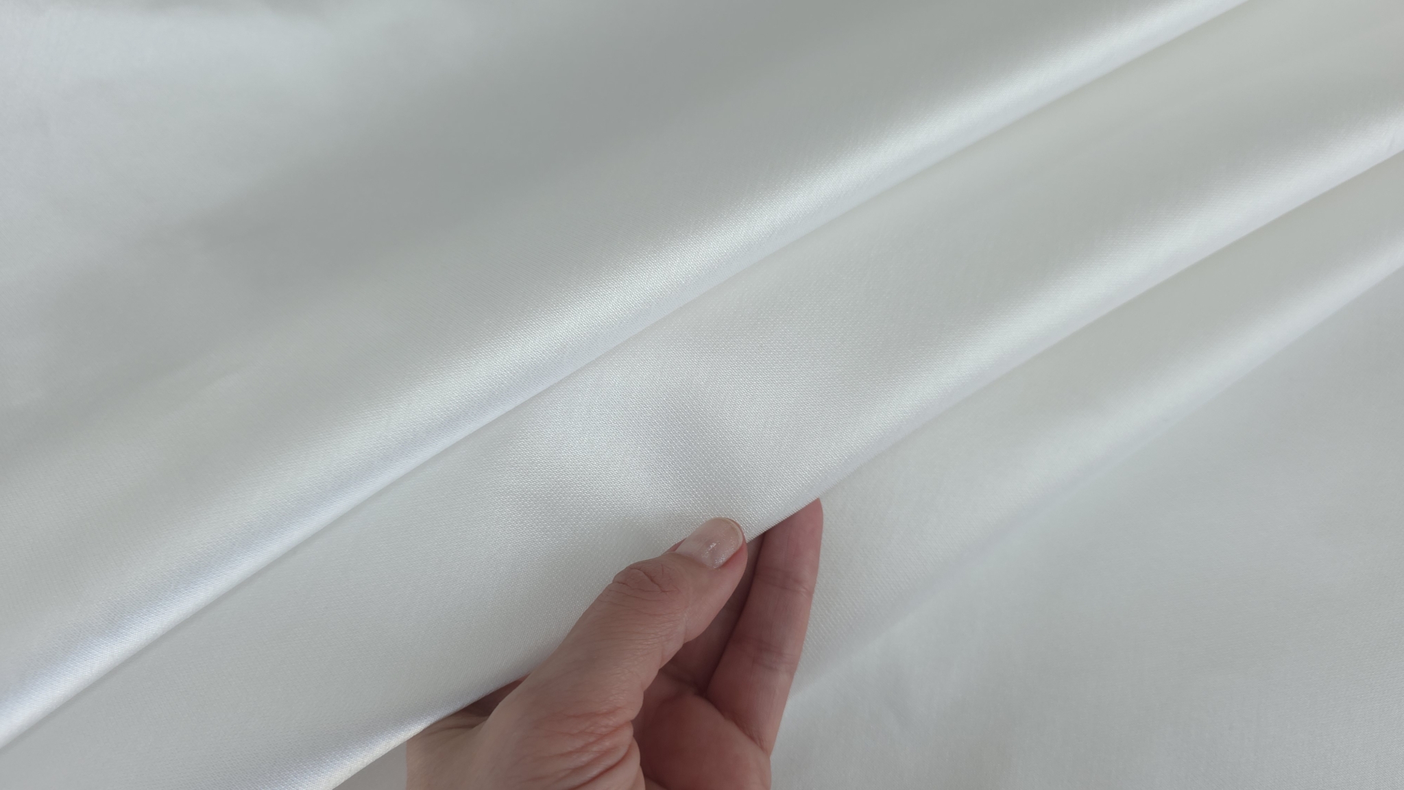 Suprafața netedă a materialului mikado ivory în plan apropiat