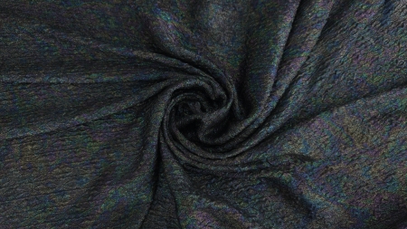 Material aranjat în spirală cu străluciri holografice vizibile