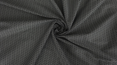 Țesătură răsucită în spirală centrală cu pliuri radiale în jurul rozetei