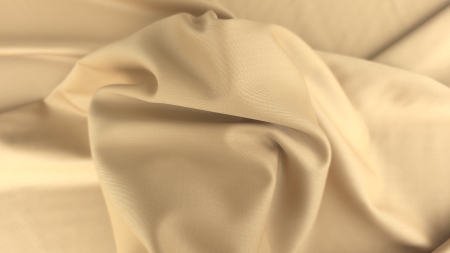 Material nude auriu ținut în mână cu falduri moi