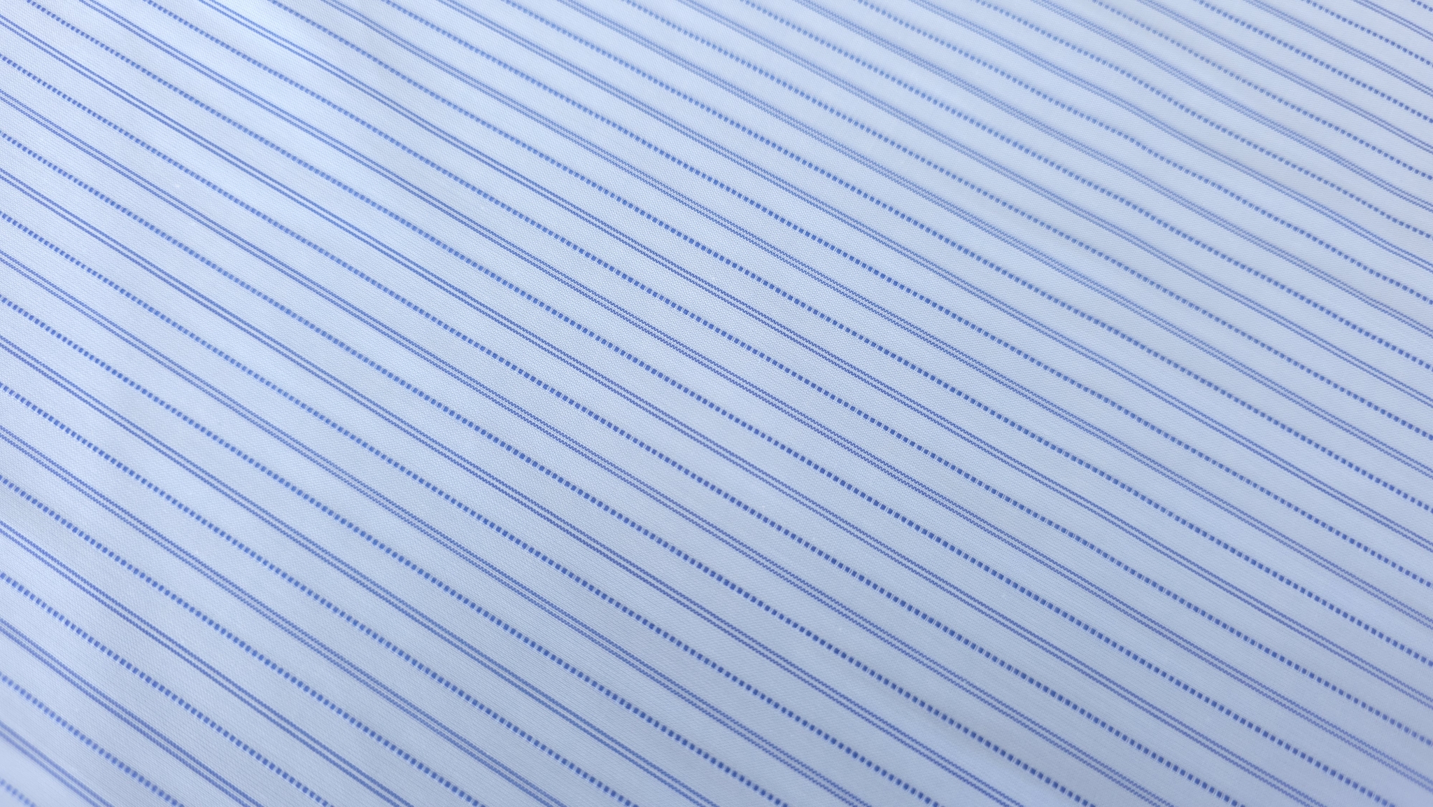 detaliu textura fina cu dungi fine albastre pe fond deschis